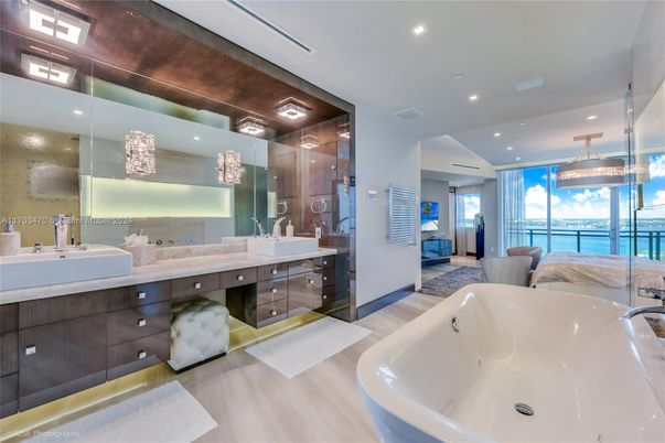 Bathroom, Dual Sink Vanities, Free Standing Baths, Glass Shower, Interior, Pendant Lights, Recessed Lighting, Wood Texture Flooring