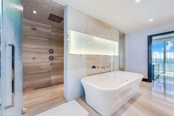 Bathroom, Free Standing Baths, Glass Shower, Interior, Recessed Lighting, Wood Texture Flooring