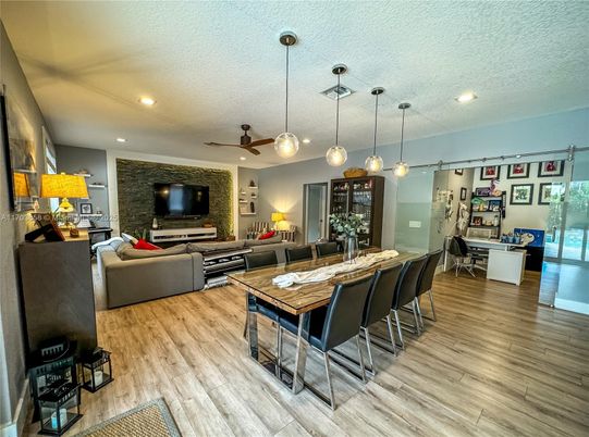 Dining room, Interior, Living room, Pendant Lights, Recessed Lighting, Stone Walls, Wood Texture Flooring