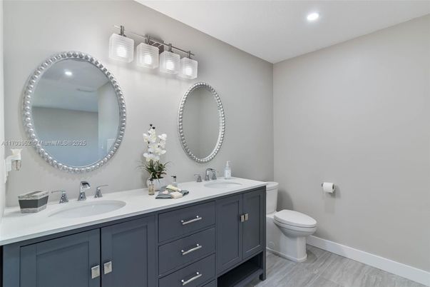 Bathroom, Dual Sink Vanities, Interior, Recessed Lighting, Wood Texture Flooring