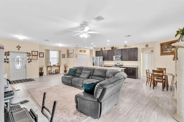 Dining room, Interior, Kitchen, Living room, Recessed Lighting, Stainless Steel Appliances, Wood Texture Flooring