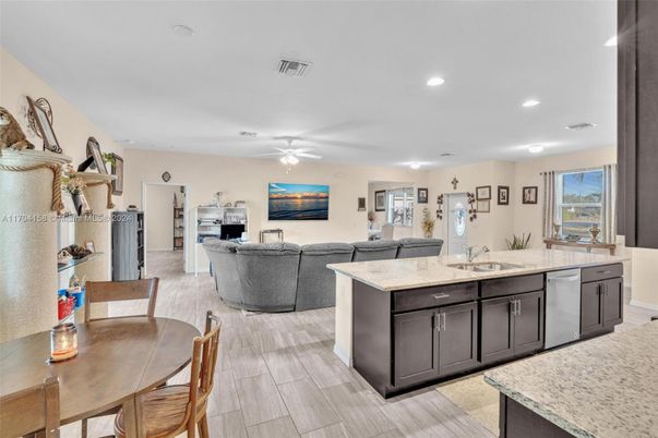 Dining room, Interior, Kitchen, Living room, Recessed Lighting, Stainless Steel Appliances, Wood Texture Flooring