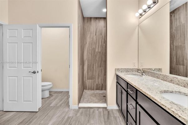 Bathroom, Dual Sink Vanities, Interior, Recessed Lighting, Wood Texture Flooring