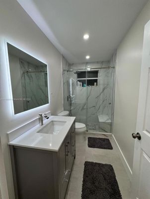 Bathroom, Dual Sink Vanities, Glass Shower, Interior, Marble Walls, Recessed Lighting