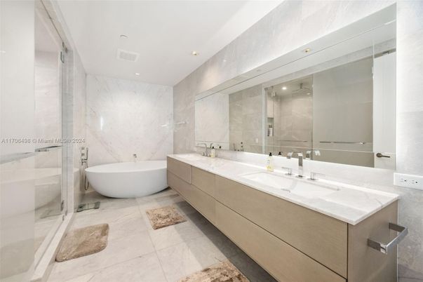 Bathroom, Dual Sink Vanities, Free Standing Baths, Glass Shower, Interior, Marble, Marble Walls, Recessed Lighting