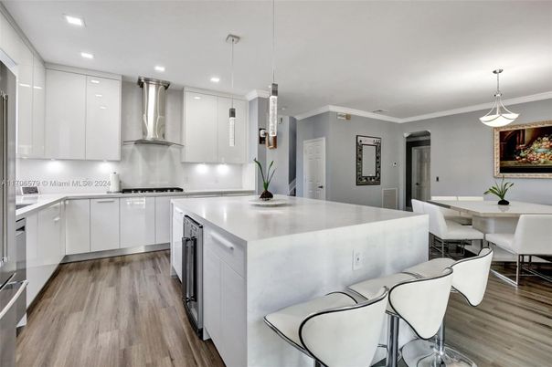 Dining room, Interior, Kitchen, Pendant Lights, Recessed Lighting, Stainless Steel Appliances, Wood Texture Flooring