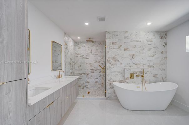 Bathroom, Dual Sink Vanities, Free Standing Baths, Glass Shower, Interior, Marble Walls, Recessed Lighting