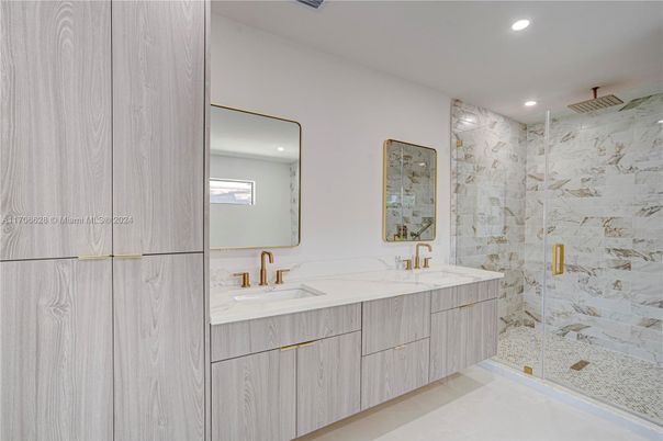 Bathroom, Dual Sink Vanities, Glass Shower, Interior, Marble Walls, Recessed Lighting
