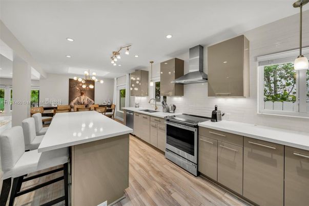 Dining room, Interior, Kitchen, Pendant Lights, Recessed Lighting, Stainless Steel Appliances, Wood Texture Flooring