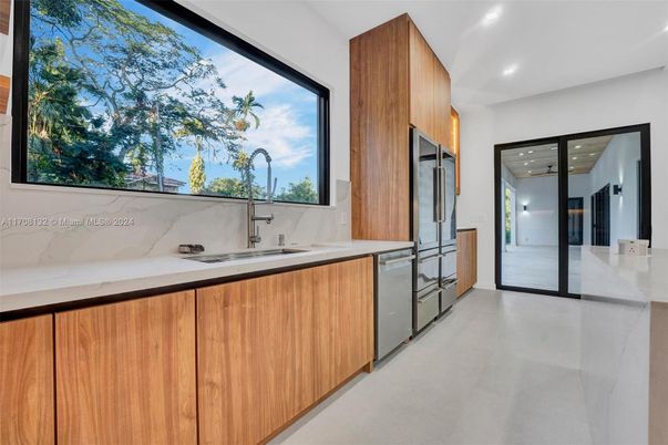 Interior, Kitchen, Marble Walls, Recessed Lighting, Stainless Steel Appliances