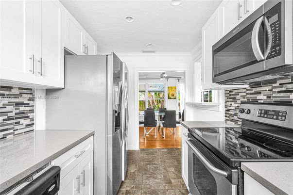 Dining room, Interior, Kitchen, Recessed Lighting, Stainless Steel Appliances, Wood Texture Flooring