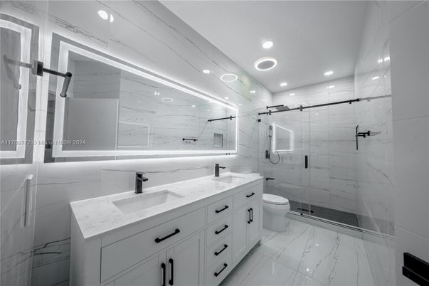 Bathroom, Dual Sink Vanities, Glass Shower, Interior, Marble, Marble Walls, Recessed Lighting