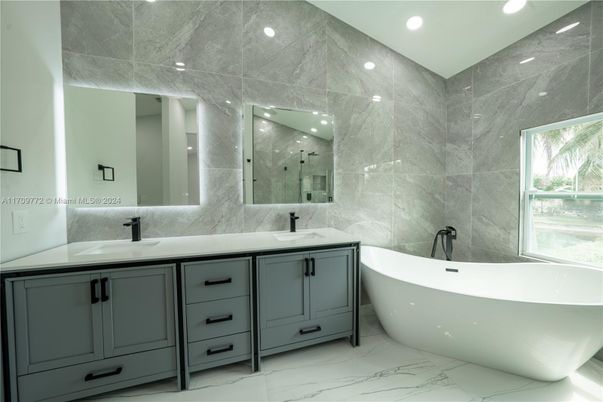Bathroom, Dual Sink Vanities, Free Standing Baths, Interior, Marble, Marble Walls, Recessed Lighting