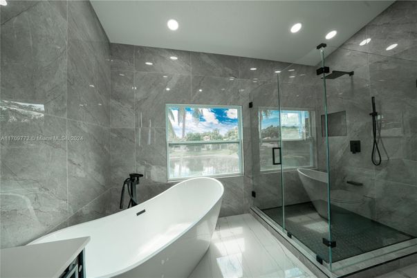 Bathroom, Free Standing Baths, Glass Shower, Interior, Marble Walls, Recessed Lighting