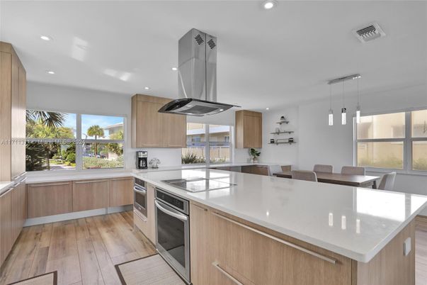 Dining room, Interior, Kitchen, Pendant Lights, Recessed Lighting, Stainless Steel Appliances, Wood Texture Flooring