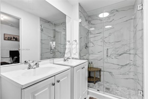 Bathroom, Dual Sink Vanities, Glass Shower, Interior, Marble Walls