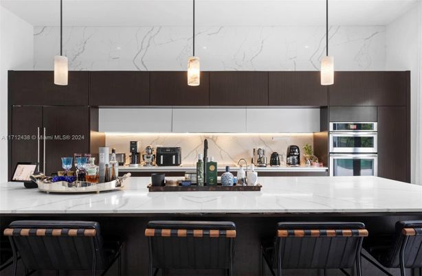 Interior, Kitchen, Marble Walls, Pendant Lights, Stainless Steel Appliances