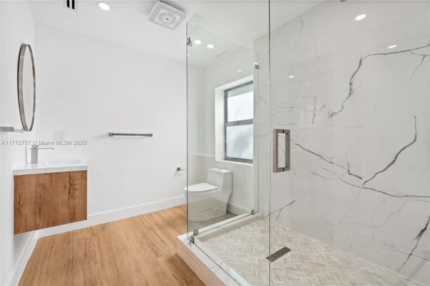 Bathroom, Glass Shower, Interior, Marble Walls, Recessed Lighting, Wood Texture Flooring