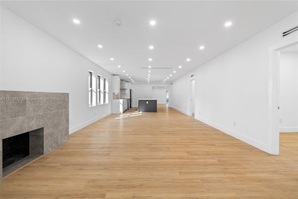 Empty room, Fireplace, Interior, Kitchen, Recessed Lighting, Wood Texture Flooring