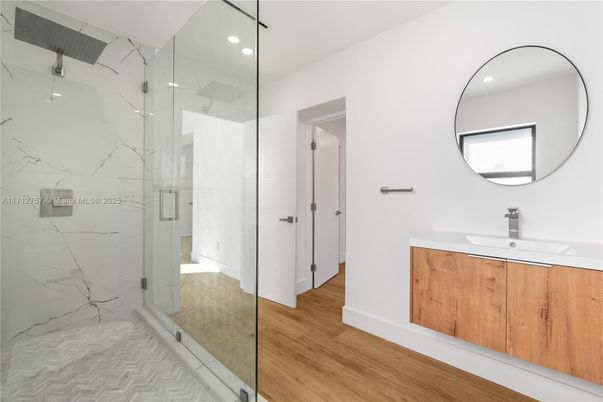 Bathroom, Glass Shower, Interior, Marble Walls, Recessed Lighting, Wood Texture Flooring
