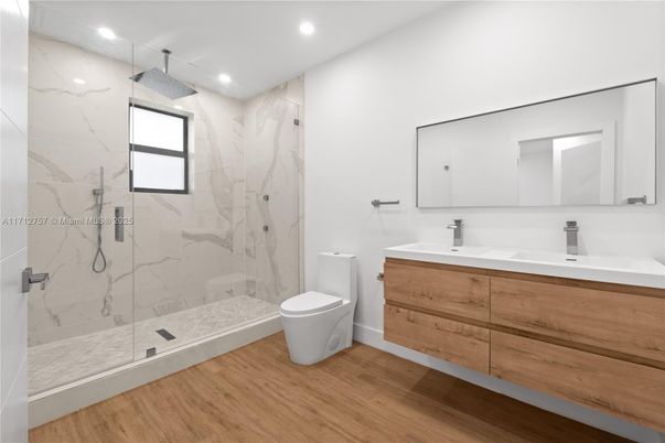 Bathroom, Glass Shower, Interior, Marble Walls, Recessed Lighting, Wood Texture Flooring