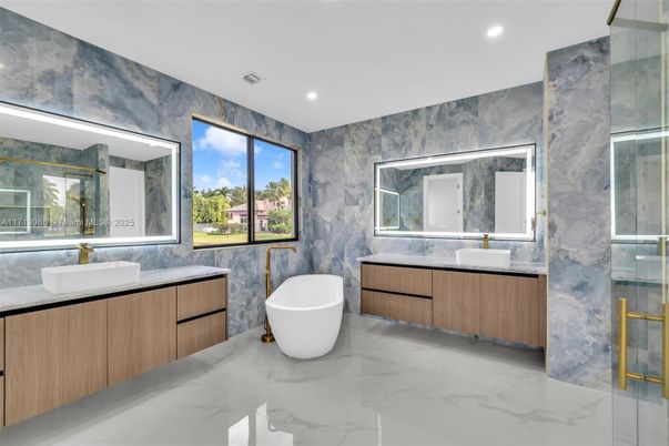 Bathroom, Dual Sink Vanities, Free Standing Baths, Glass Shower, Interior, Marble, Marble Walls, Recessed Lighting