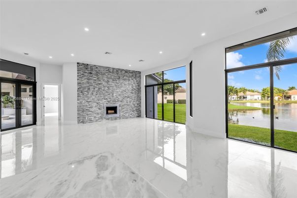 Empty room, Fireplace, Interior, Marble, Recessed Lighting, Stone Walls, Water