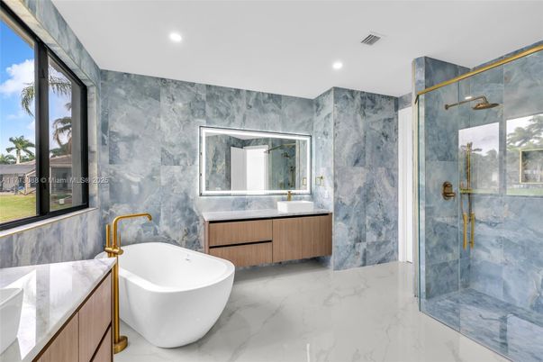 Bathroom, Dual Sink Vanities, Free Standing Baths, Glass Shower, Interior, Marble, Marble Walls, Recessed Lighting
