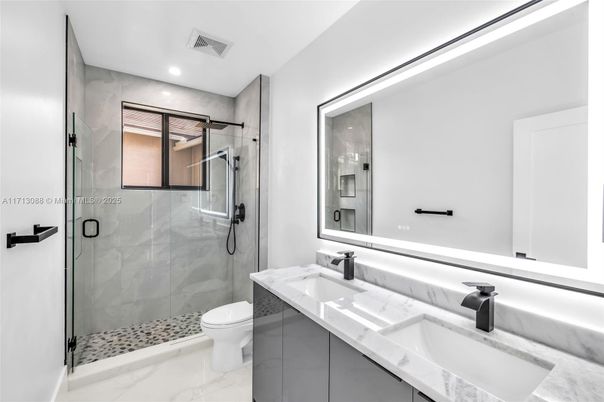 Bathroom, Dual Sink Vanities, Glass Shower, Interior, Marble, Recessed Lighting