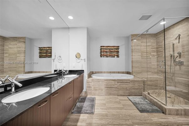 Bathroom, Dual Sink Vanities, Glass Shower, Interior, Recessed Lighting, Wood Texture Flooring