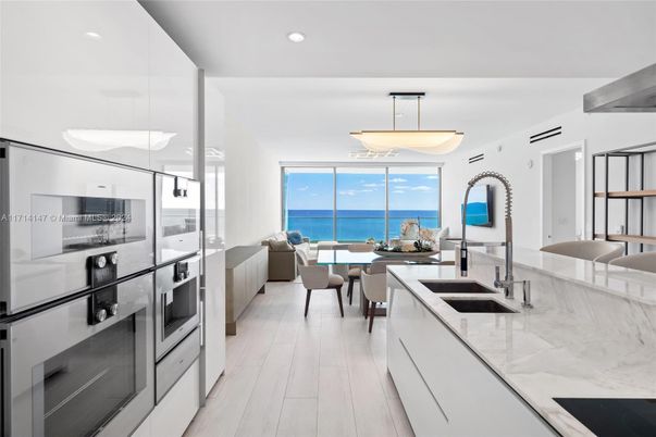 Dining room, Interior, Kitchen, Pendant Lights, Recessed Lighting, Stainless Steel Appliances, Water, Wood Texture Flooring
