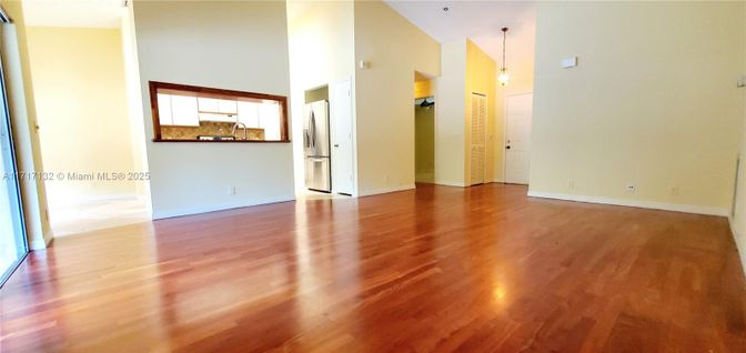 Empty room, Interior, Kitchen, Pendant Lights, Stainless Steel Appliances, Wood Texture Flooring