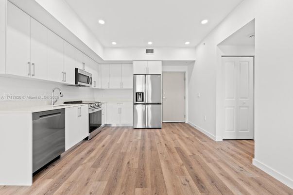Interior, Kitchen, Recessed Lighting, Stainless Steel Appliances, Wood Texture Flooring