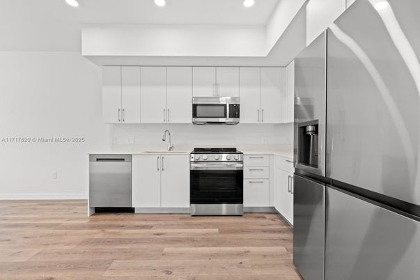 Interior, Kitchen, Recessed Lighting, Stainless Steel Appliances, Wood Texture Flooring