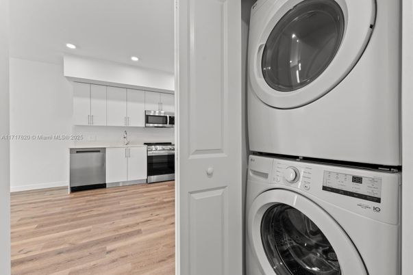 Interior, Kitchen, Recessed Lighting, Stainless Steel Appliances, Utility Closets, Washer, Wood Texture Flooring