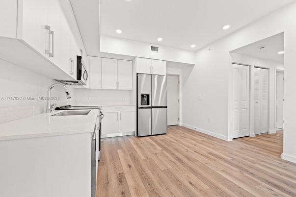 Interior, Kitchen, Recessed Lighting, Stainless Steel Appliances, Wood Texture Flooring