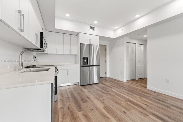 Interior, Kitchen, Recessed Lighting, Stainless Steel Appliances, Wood Texture Flooring