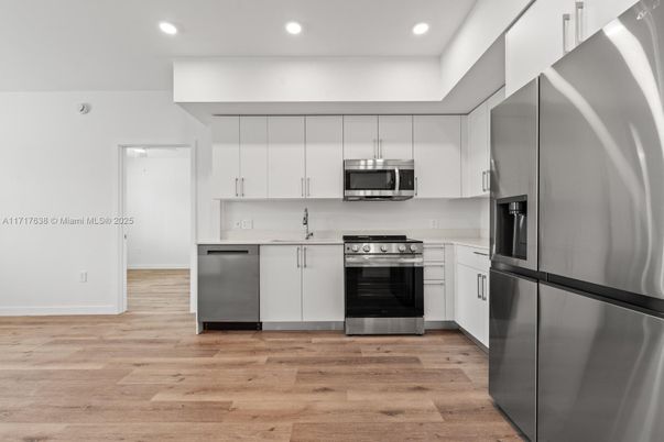 Interior, Kitchen, Recessed Lighting, Stainless Steel Appliances, Wood Texture Flooring