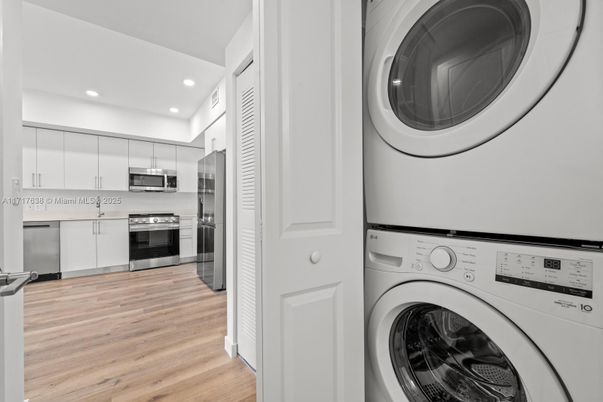 Interior, Kitchen, Recessed Lighting, Stainless Steel Appliances, Utility Closets, Washer, Wood Texture Flooring