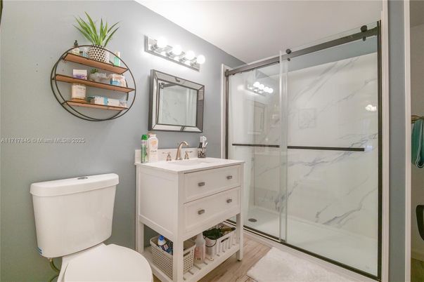 Bathroom, Glass Shower, Interior, Marble Walls, Wood Texture Flooring