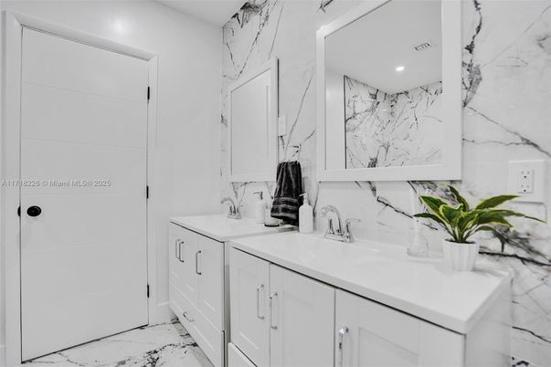 Bathroom, Dual Sink Vanities, Interior, Marble, Marble Walls, Recessed Lighting