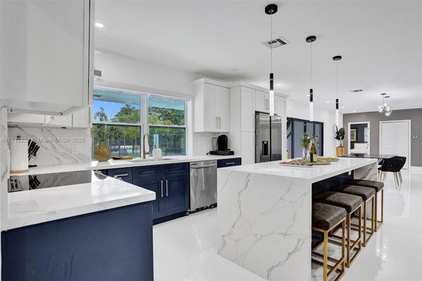 Interior, Kitchen, Marble, Marble Walls, Pendant Lights, Recessed Lighting, Stainless Steel Appliances