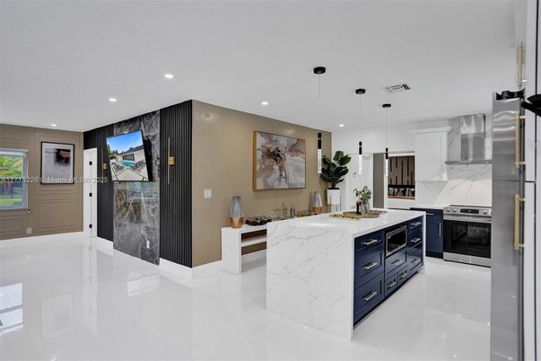 Interior, Kitchen, Marble Walls, Pendant Lights, Recessed Lighting, Stainless Steel Appliances