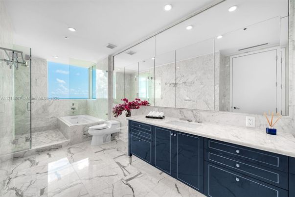 Bathroom, Dual Sink Vanities, Glass Shower, Interior, Marble, Marble Walls, Recessed Lighting