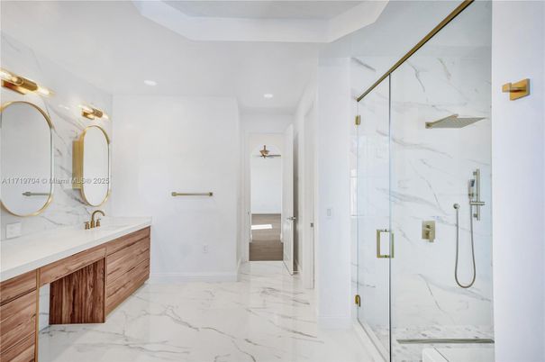 Bathroom, Dual Sink Vanities, Glass Shower, Interior, Marble, Marble Walls, Recessed Lighting