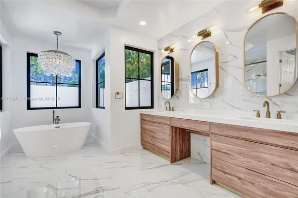 Bathroom, Dual Sink Vanities, Free Standing Baths, Interior, Marble, Marble Walls, Pendant Lights, Recessed Lighting
