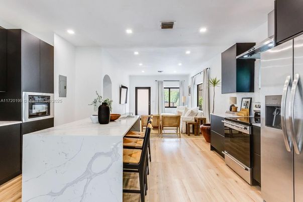 Dining room, Interior, Kitchen, Recessed Lighting, Stainless Steel Appliances, Wood Texture Flooring