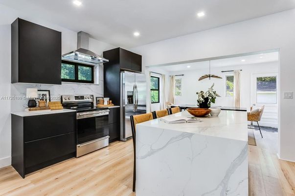 Dining room, Interior, Kitchen, Pendant Lights, Recessed Lighting, Stainless Steel Appliances, Wood Texture Flooring