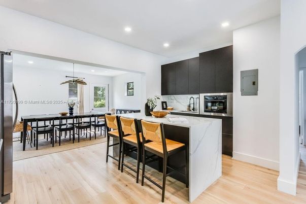 Dining room, Interior, Kitchen, Pendant Lights, Recessed Lighting, Stainless Steel Appliances, Wood Texture Flooring