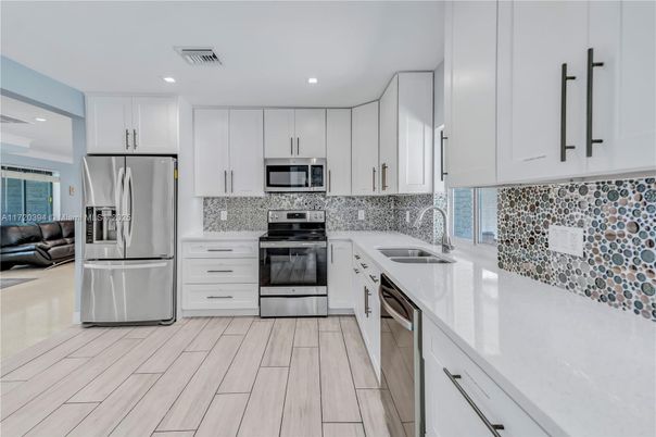 Interior, Kitchen, Recessed Lighting, Stainless Steel Appliances, Wood Texture Flooring